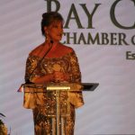 Claire Sherman, 2017 Chairman of the Board, awards Member of the Year Award to Waylon Thompson and Doug Smith.