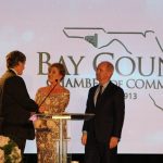 Claire Sherman, 2017 Chairman of the Board, awards Member of the Year Award to Waylon Thompson and Doug Smith.