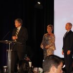 Claire Sherman, 2017 Chairman of the Board, awards Member of the Year Award to Waylon Thompson and Doug Smith.
