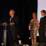 Claire Sherman, 2017 Chairman of the Board, awards Member of the Year Award to Waylon Thompson and Doug Smith.