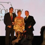 Claire Sherman, 2017 Chairman of the Board, awards Chairman's Award to Glenn McDonald and Tom Neubauer.